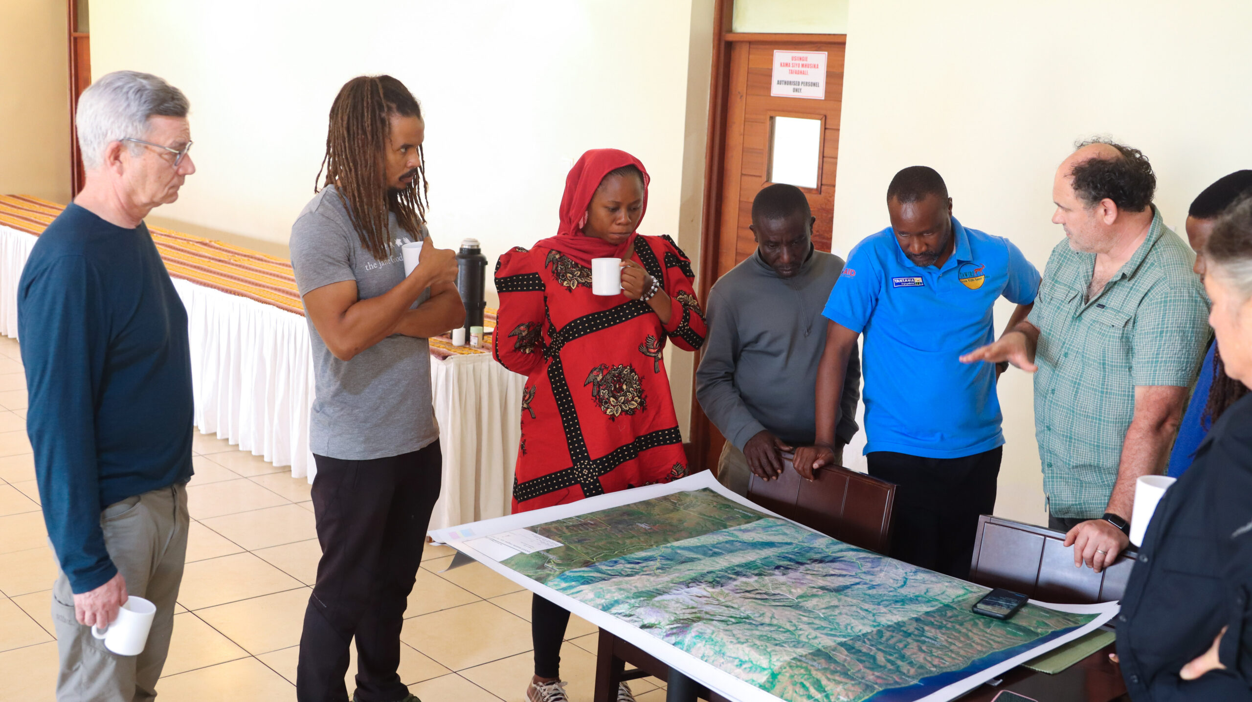 Merlin Van Lawick participating in a community mapping practice at Kagunga Village, Tanzania. Image © Jane Goodall Institute.