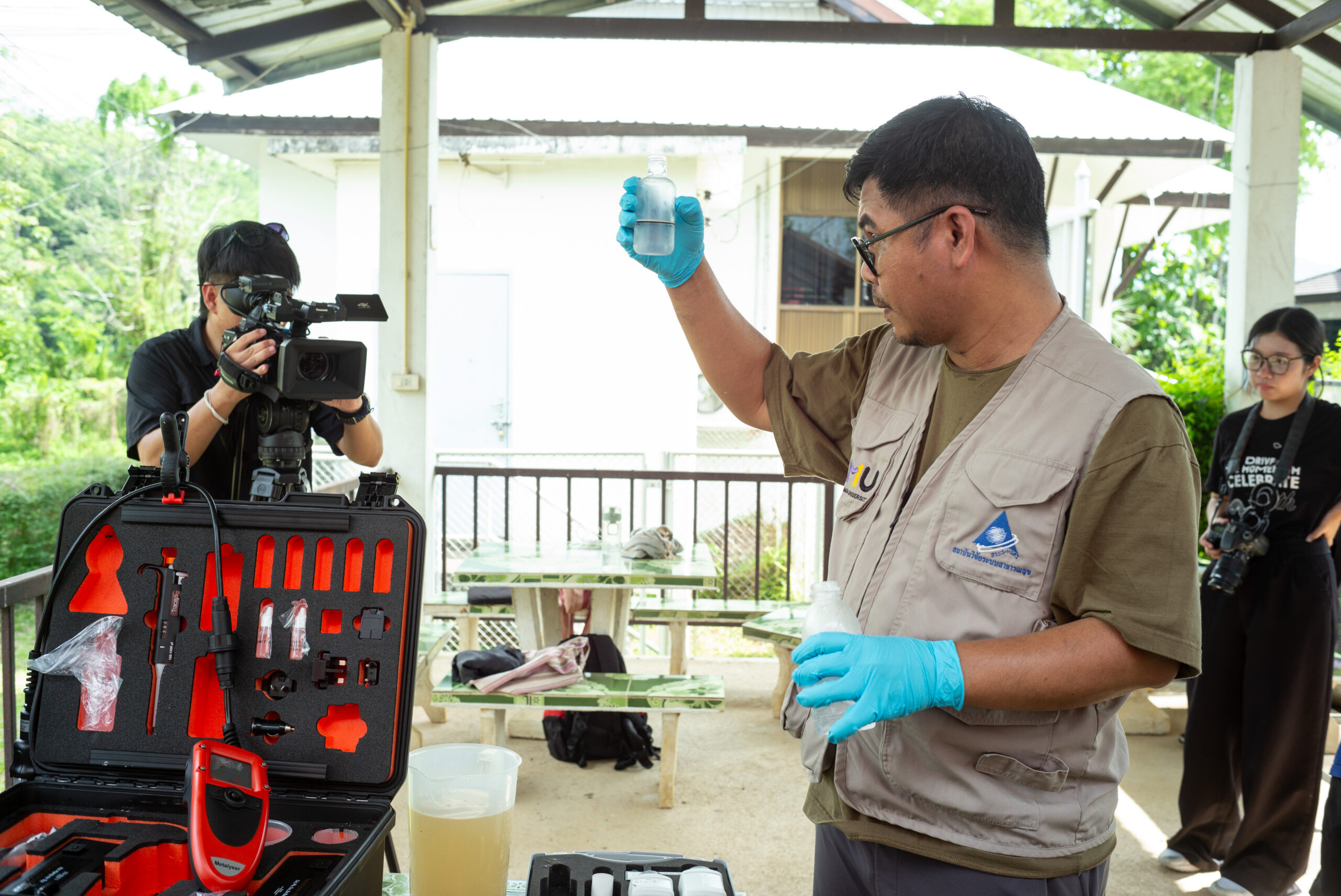 Professor Wan Wiriya from Chiang Mai University tests water and sediment samples from the Kok River on June 4, 2025. Photo by Ta Mwe.