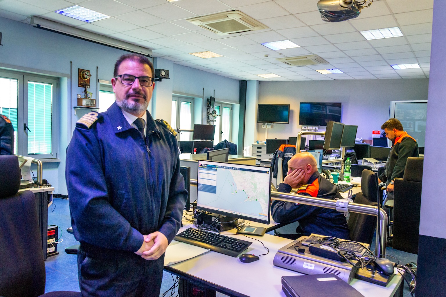 Roberto Larocca in the control room at the Port Authority station in Naples, where officers constantly monitor the location and movements of vessels at sea. Image by Manuela Callari for Mongabay.