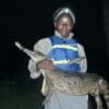 Christine Kouman with a slender-snouted crocodile (Mecistops cataphractus). Image courtesy of Agata Staniewicz.