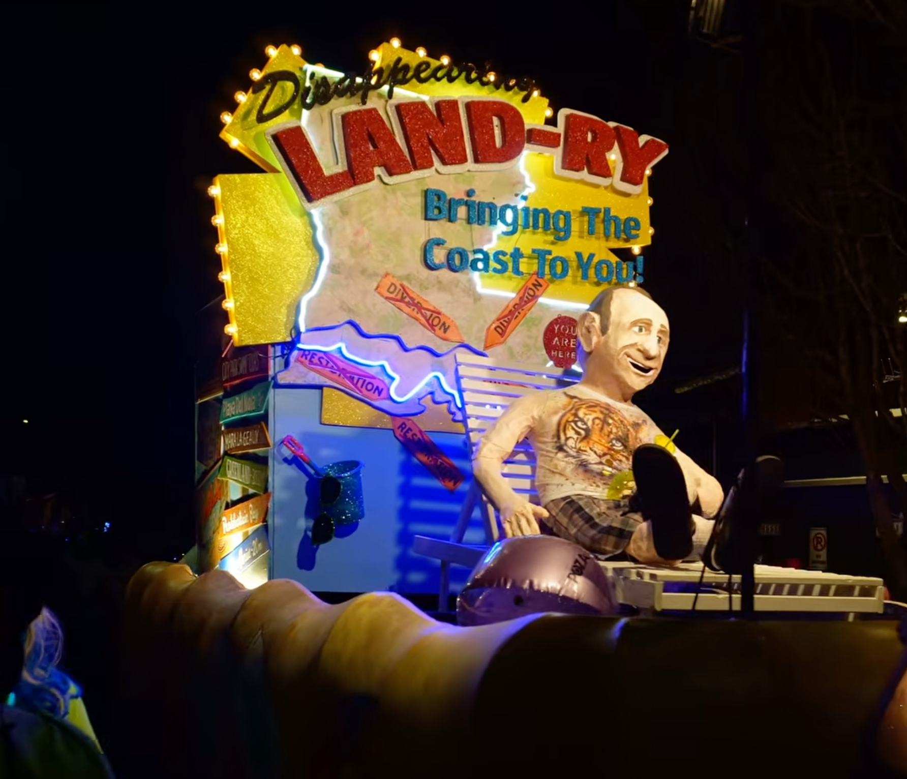 Krewe du Vieux float depicts Louisiana's eroding coastline and current Louisiana governor Jeff Landry. Photo by Liz Kimbrough for Mongabay. 