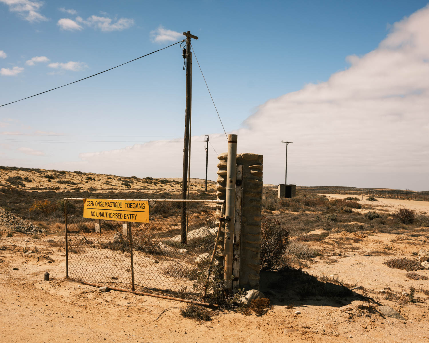 The entrance of a diamond mine in Hondeklipbaai that closed its doors in the early 2000’s; many local people lost their jobs and livelihoods. Image courtesy of Gary van Wyk.