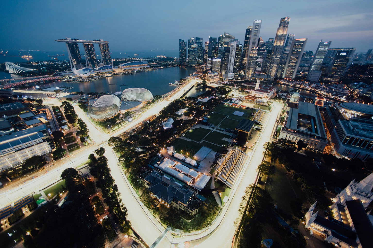 Singapore aglow at twilight. This urban state is among the most responsive to mitigating urban heat island effects.