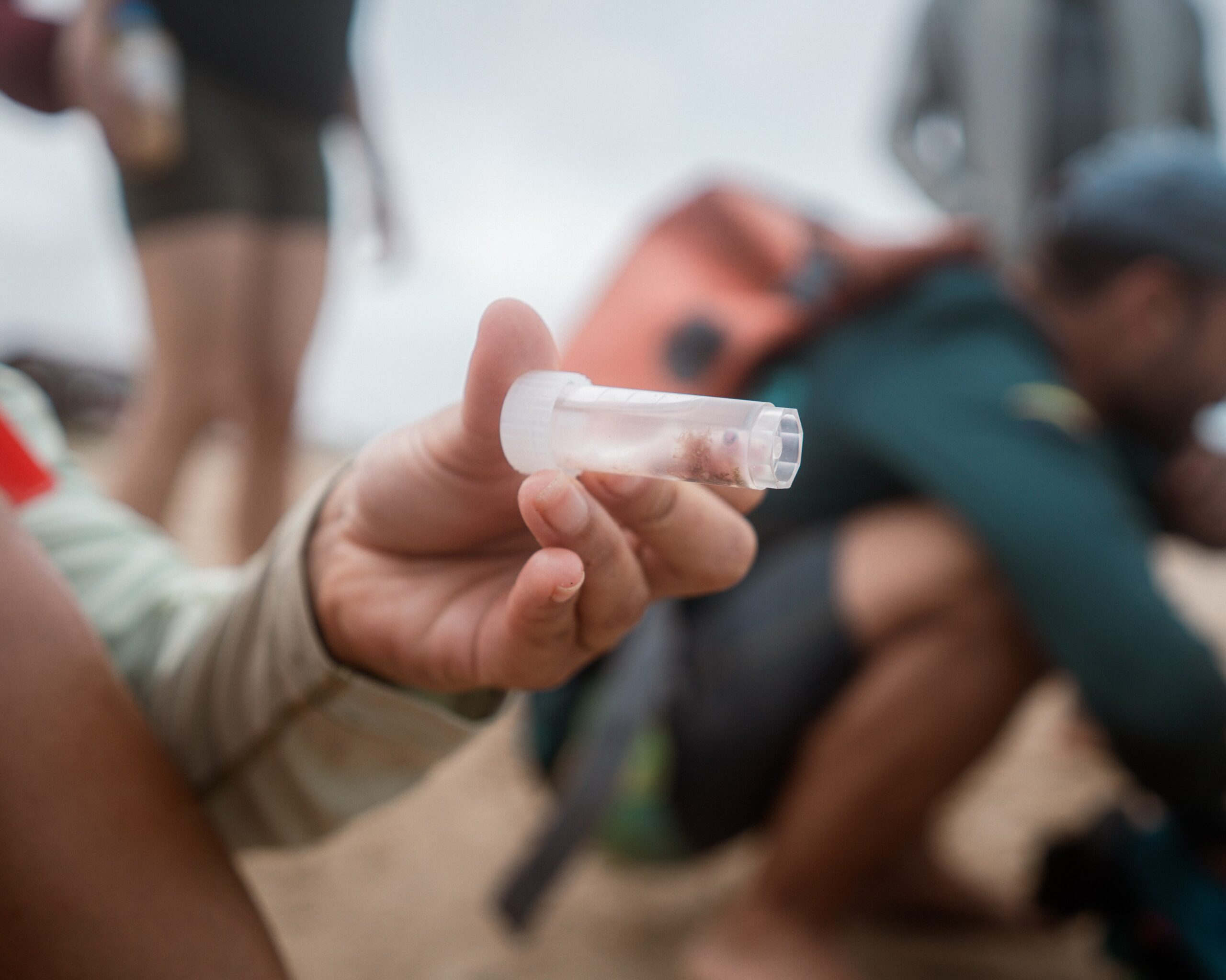 A marine biologist working with Proyecto Puyuii holds a small vial containing a smooth-hound shark embryo, taken from the carcass of its caught mother. Image by Euan Wallace.