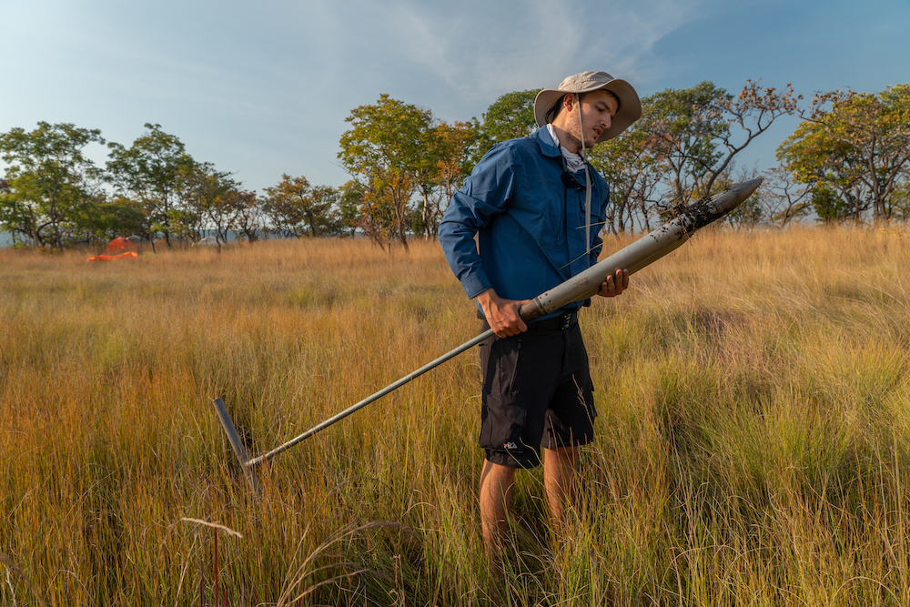 Study author Mauro Lourenço collecting the peat material during the research for this study. Image courtesy of Jennifer Guyton.