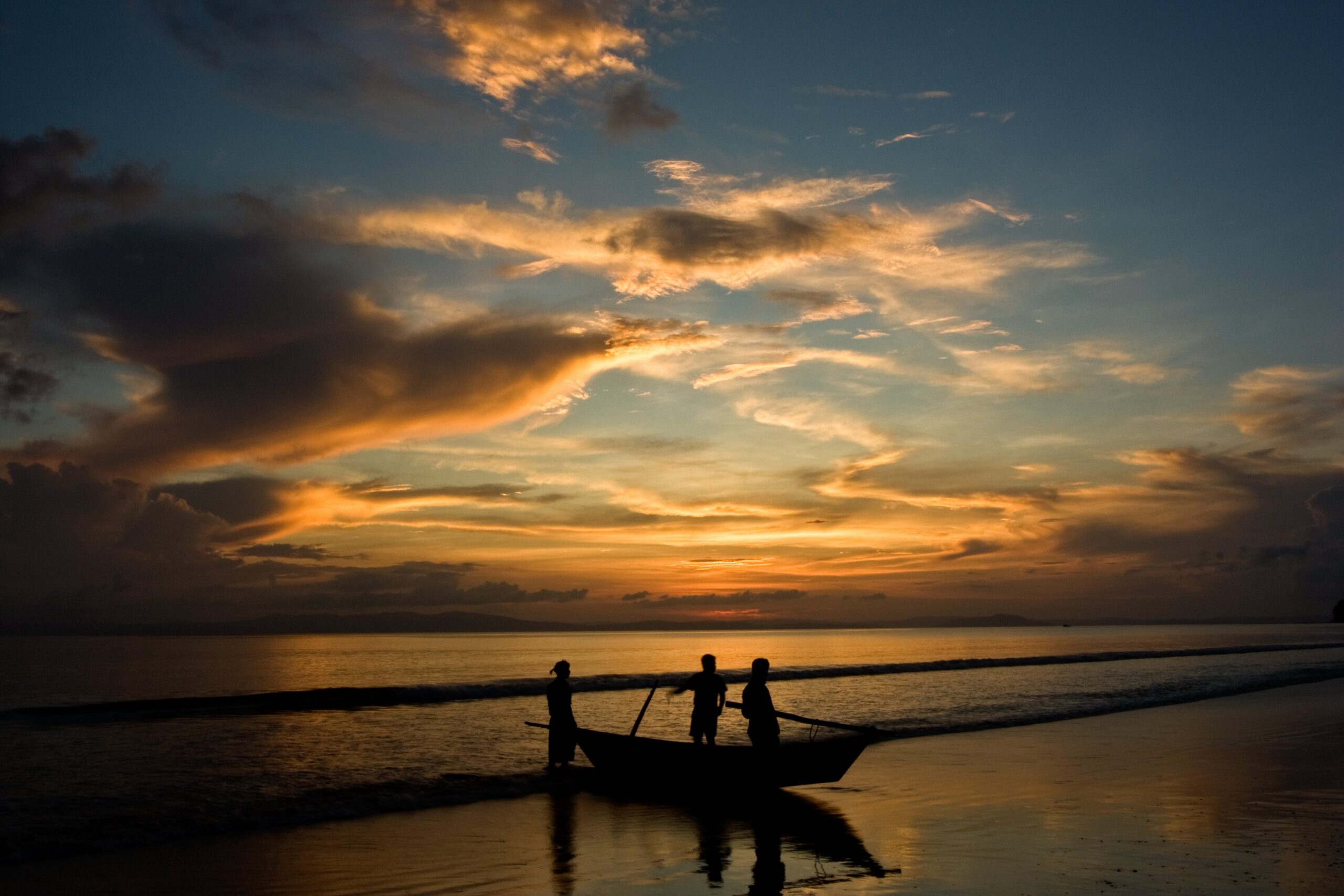 Fishermen returning from their trip at sunset. Andaman Islands, India. Image by Jakub Michankow - Back from fishing trip. CC BY 2.0.