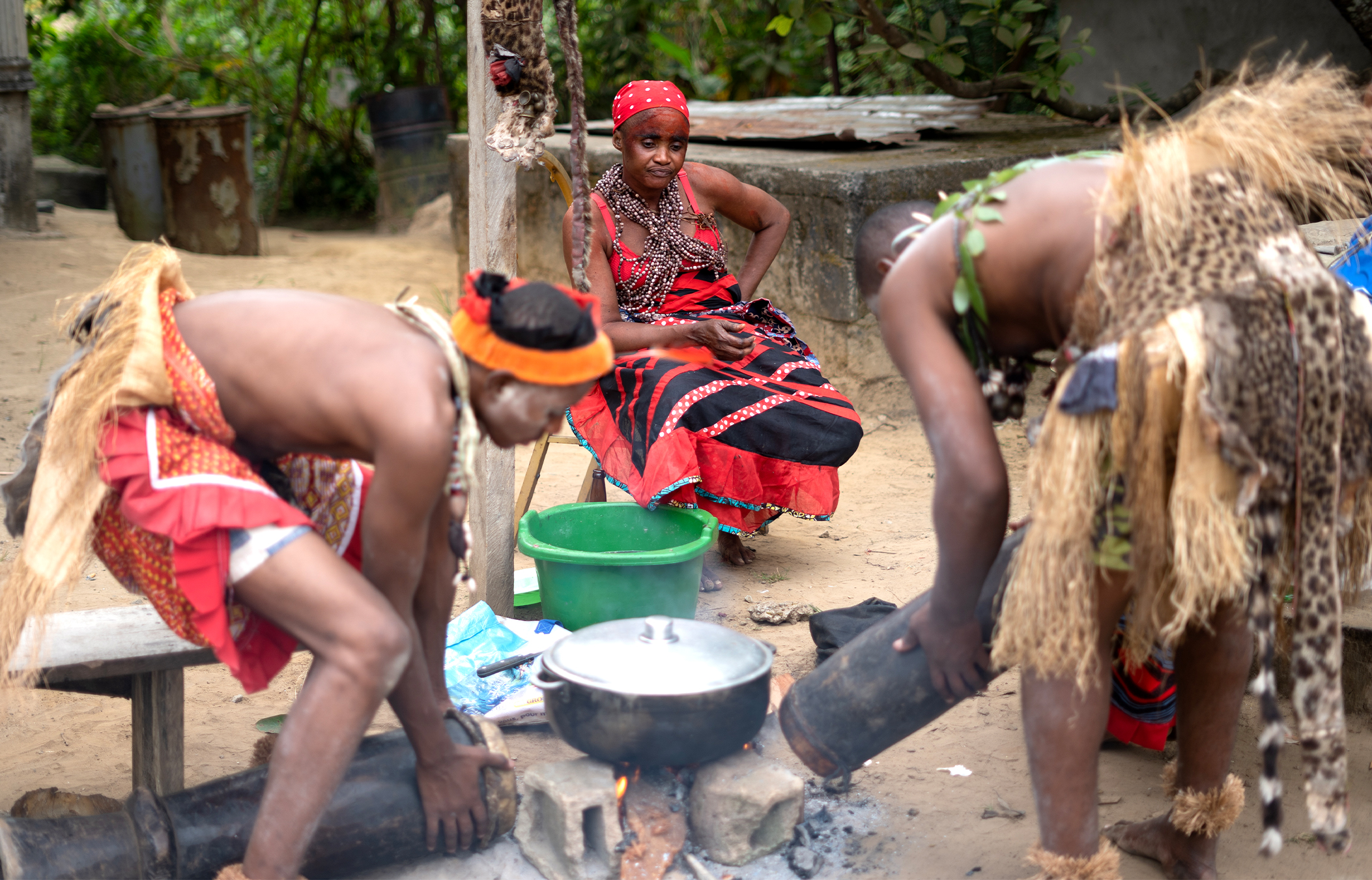 The morning after a Mubindu ceremony within the Misoko tradition, community members gather and return to everyday life around the temple in Gabon. Image by Molly Helfend.