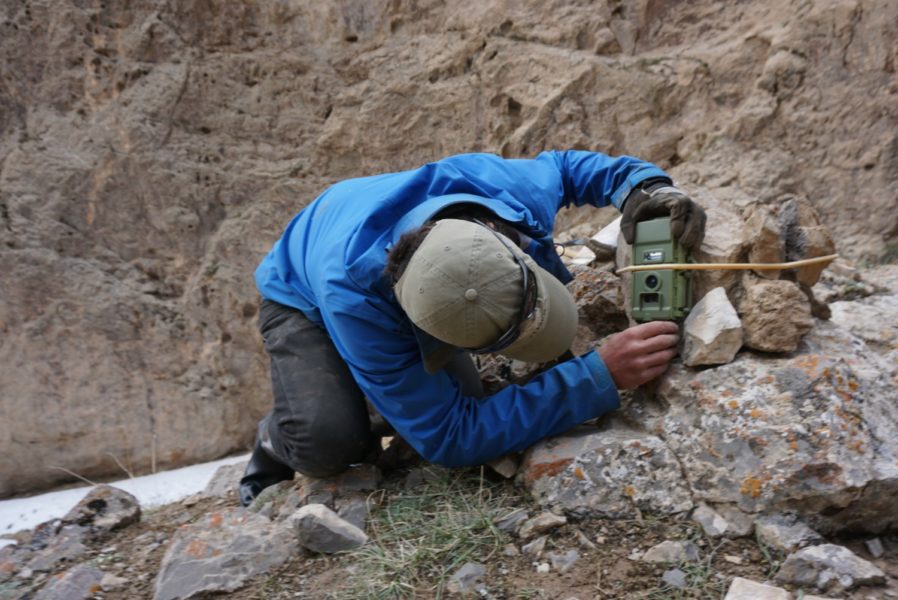 Shannon Kachel setting a camera trap for snow leopards, Kyrgyzstan. Photo credit: R. Bayrakcismith -Panthera-SAEF-NAS-UW.