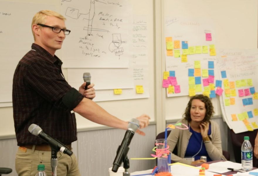 Hal Holmes explains a blue-sky approach in design to his working group's DNA barcode scanner. Photo credit: Sarah Snyder.