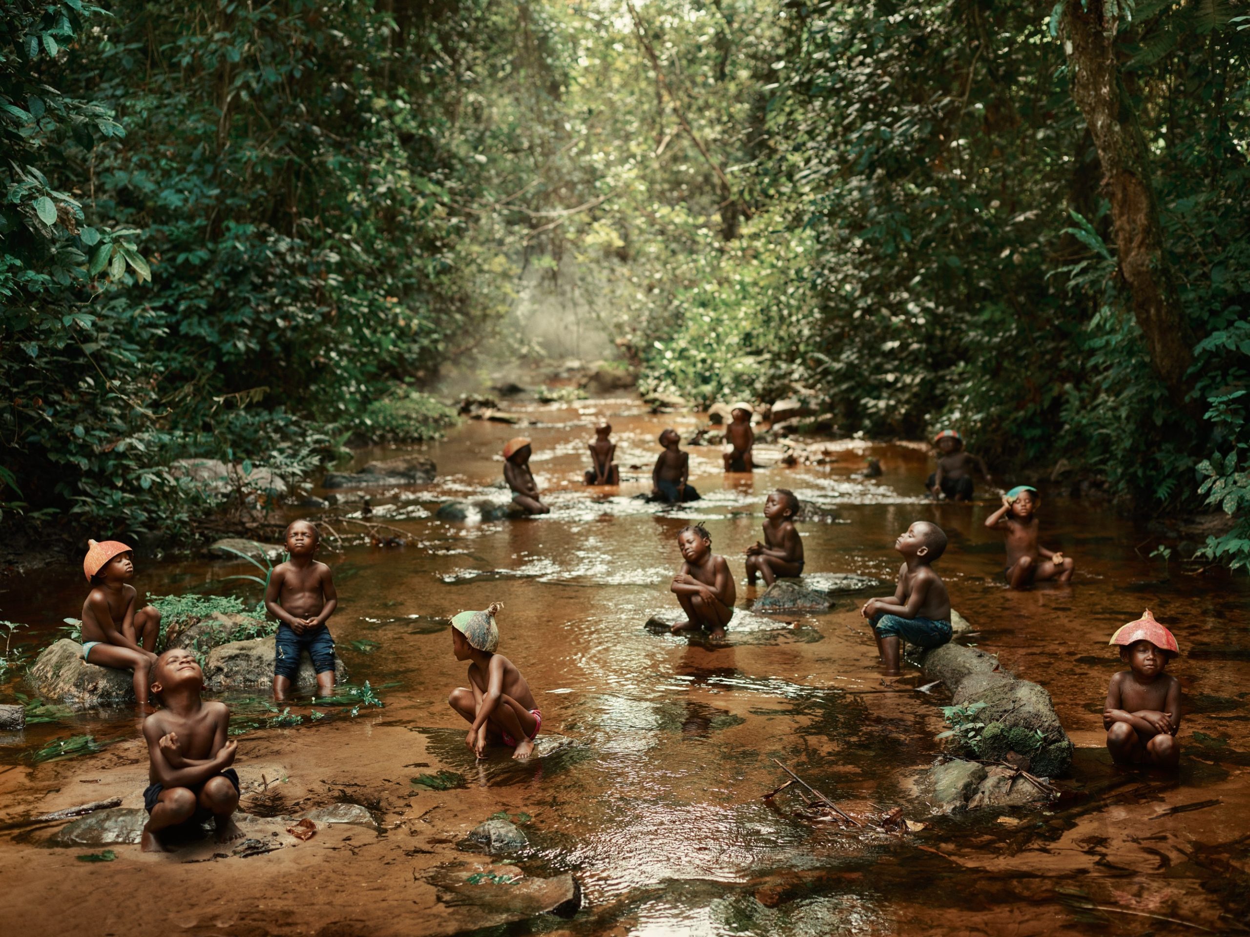 Children relaxing in the clear water of a shallow river in Odzala-Kokoua National Park, Republic of Congo. Image by Pieter Henket (CC BY-SA 4.0)
