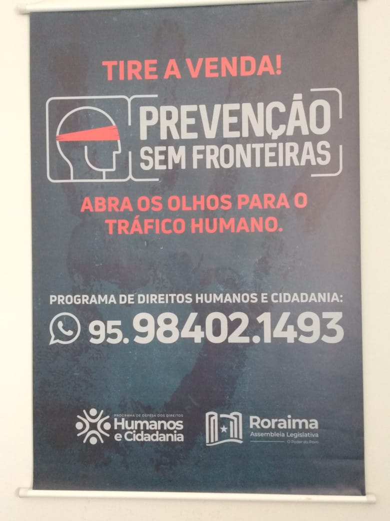 Cartaz do Programa Prevenção sem Fronteiras incentiva a denúncia em Boa Vista. Imagem de Elizabeth Oliveira.