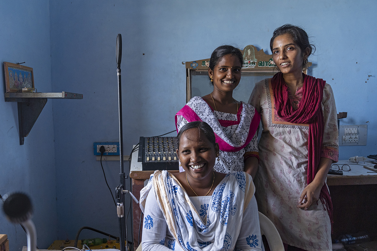 (L to R) Ranjitha (radio jockey), Durga (volunteer) and Aparna (station director) inside the recording room at Kalanjiam Samuga Vanoli, a community radio station based in Nagapattinam district, Tamil Nadu. Credit: Kartik Chandramouli/Mongabay