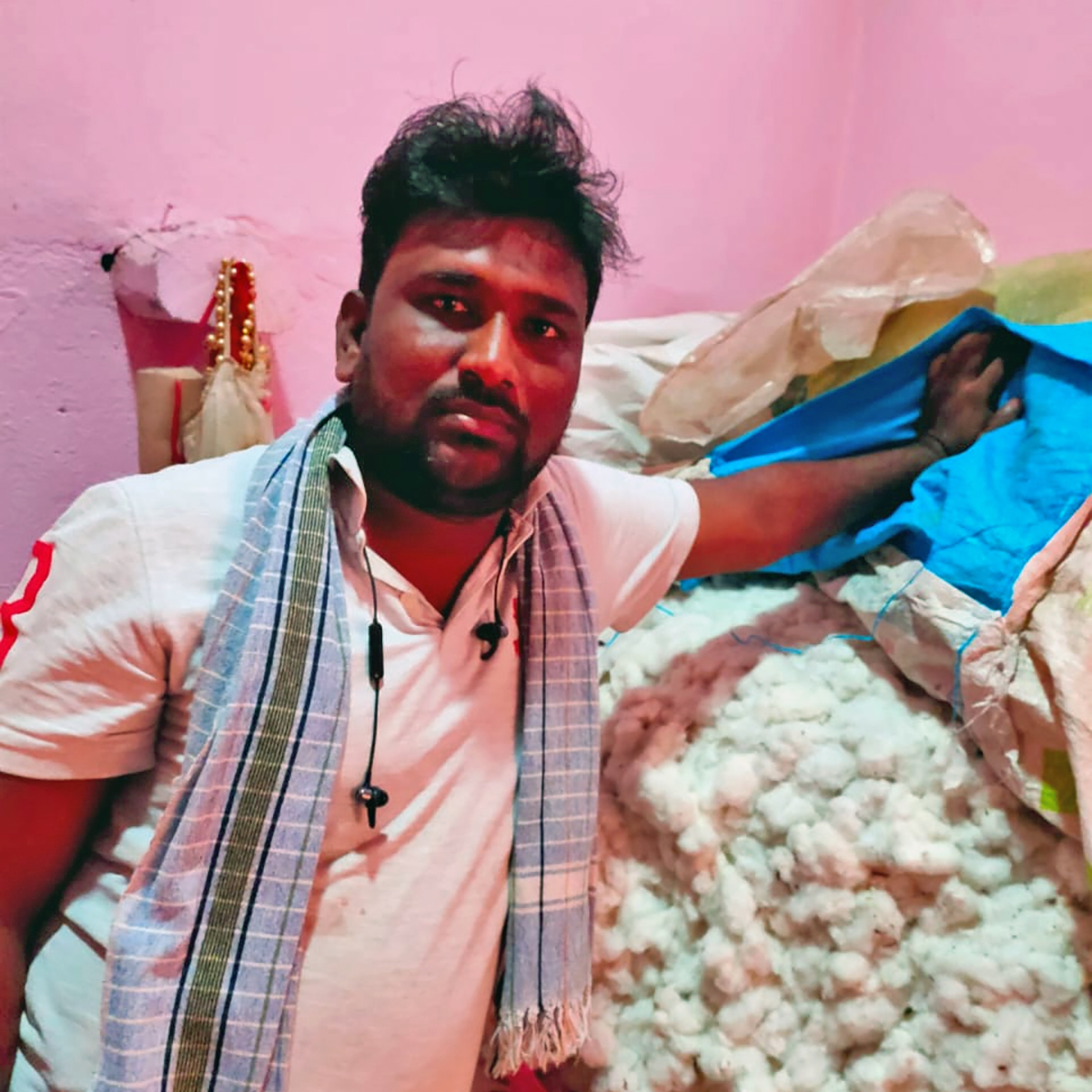 Kiran Pawar, a farmer from Latur, Maharashtra shows his cotton produce left unsold due to the COVID-19 lockdown. Photo from Kiran Pawar.