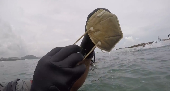 Heaps of masks were found along with other biomedical waste on Rushikonda beach seabed. Photo courtesy- Platypus Escapes, Visakhapatnam.