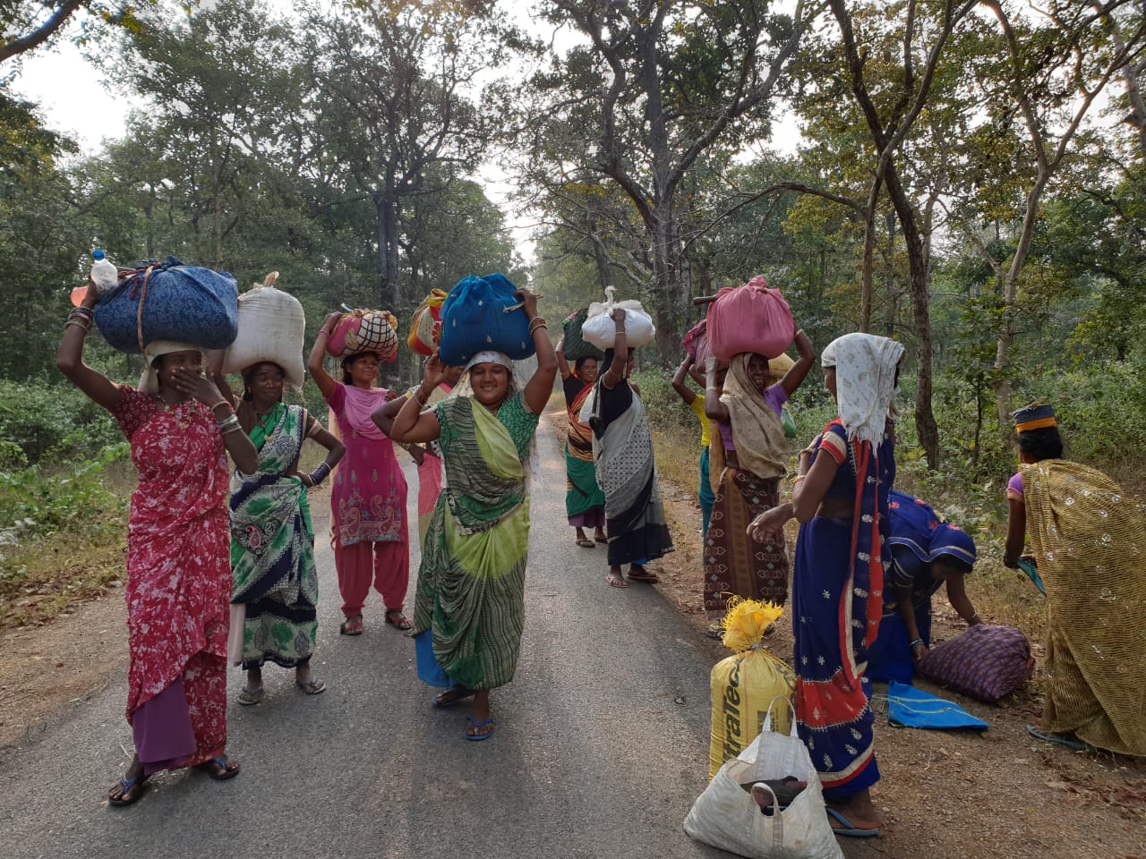 A group of woman going to market to sell forest produces.