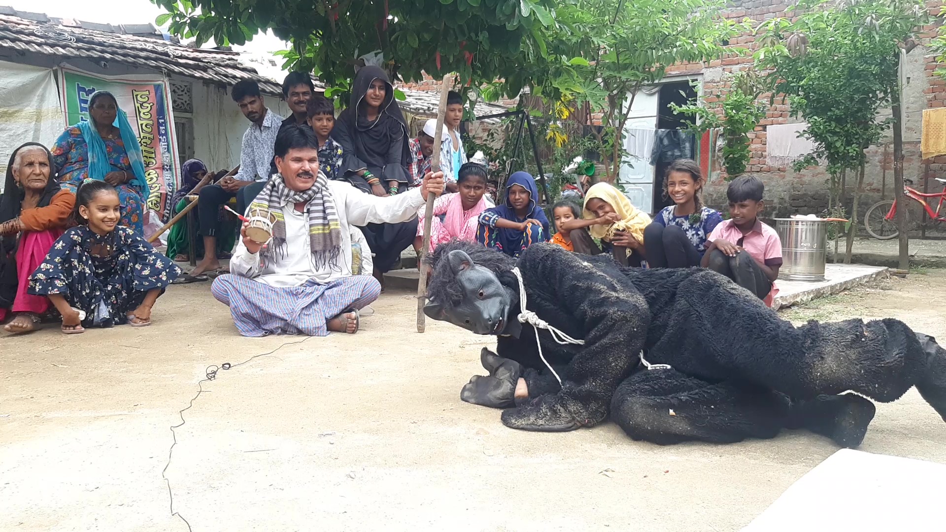 Zamil Ahmed dresses in a black fur costume in absence of bear. Photo by Madhav Sharma