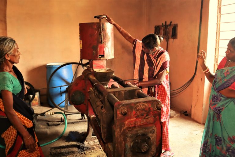 Group of women working on a mustard cake processing unit at Guniya in Gumla district of Jharkhand. Photo by-Manish Kumar