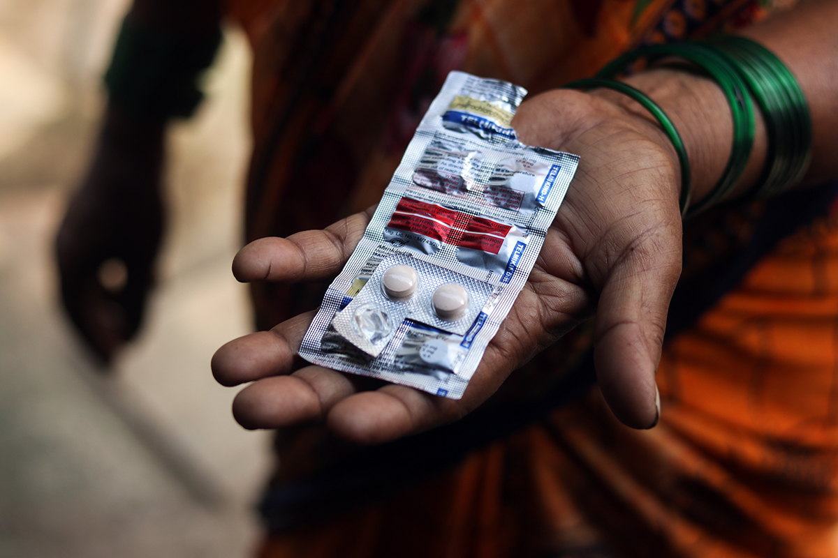 Mounting stress and anxiety induced by unpredictable weather and crop losses eventually led to a rise in Hirabai Hugge’s blood pressure, after which she was diagnosed with hypertension. In addition to hypertension medicine, the farm labourer now takes painkillers to deal with the fatigue. Photo by Sanket Jain/Mongabay.