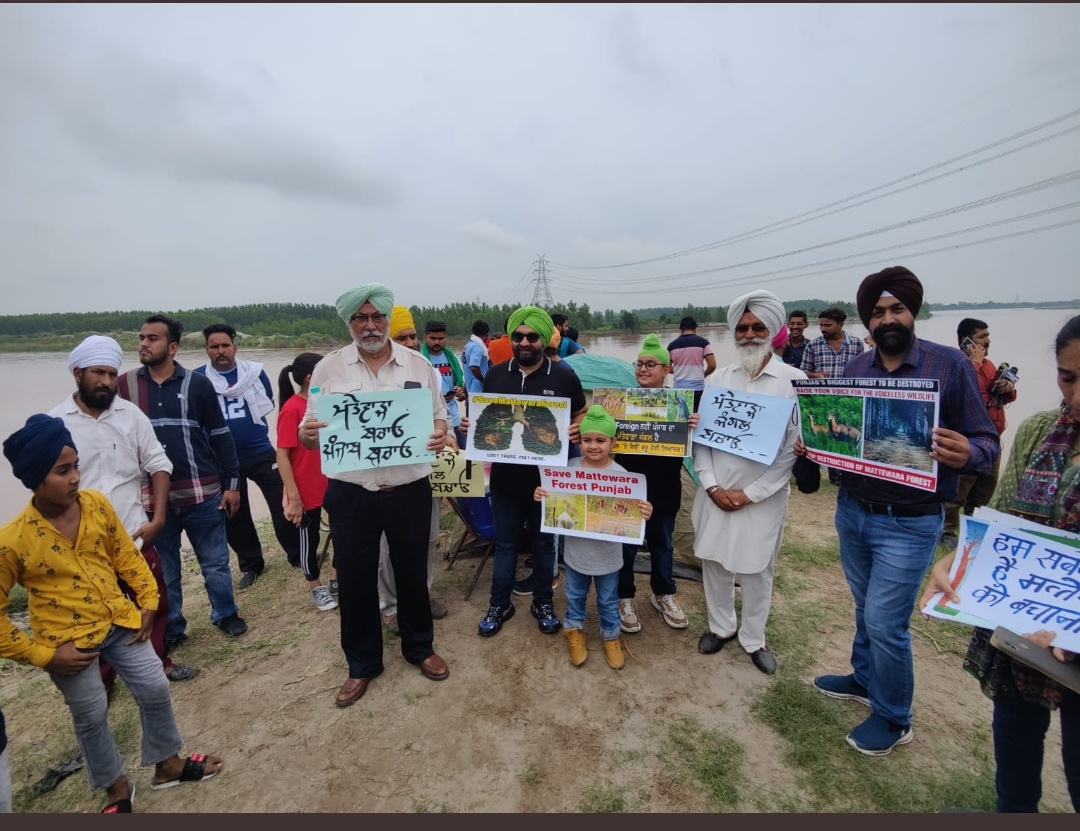 Civil society members at the project site with banners to protect Mattewara forest and the Sutlej river. Photo by special arrangement.