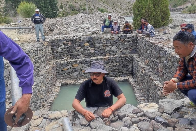 Hit hard by the depletion of traditional irrigation sources, Tandi residents laid water pipes to draw water from the river. Photo by Romit Kumar.