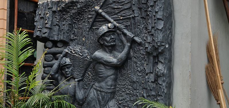 Image shows a mural depicting coal mine workers