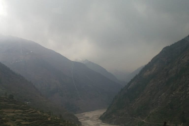 Image shows clouds overshadowing mountains in India