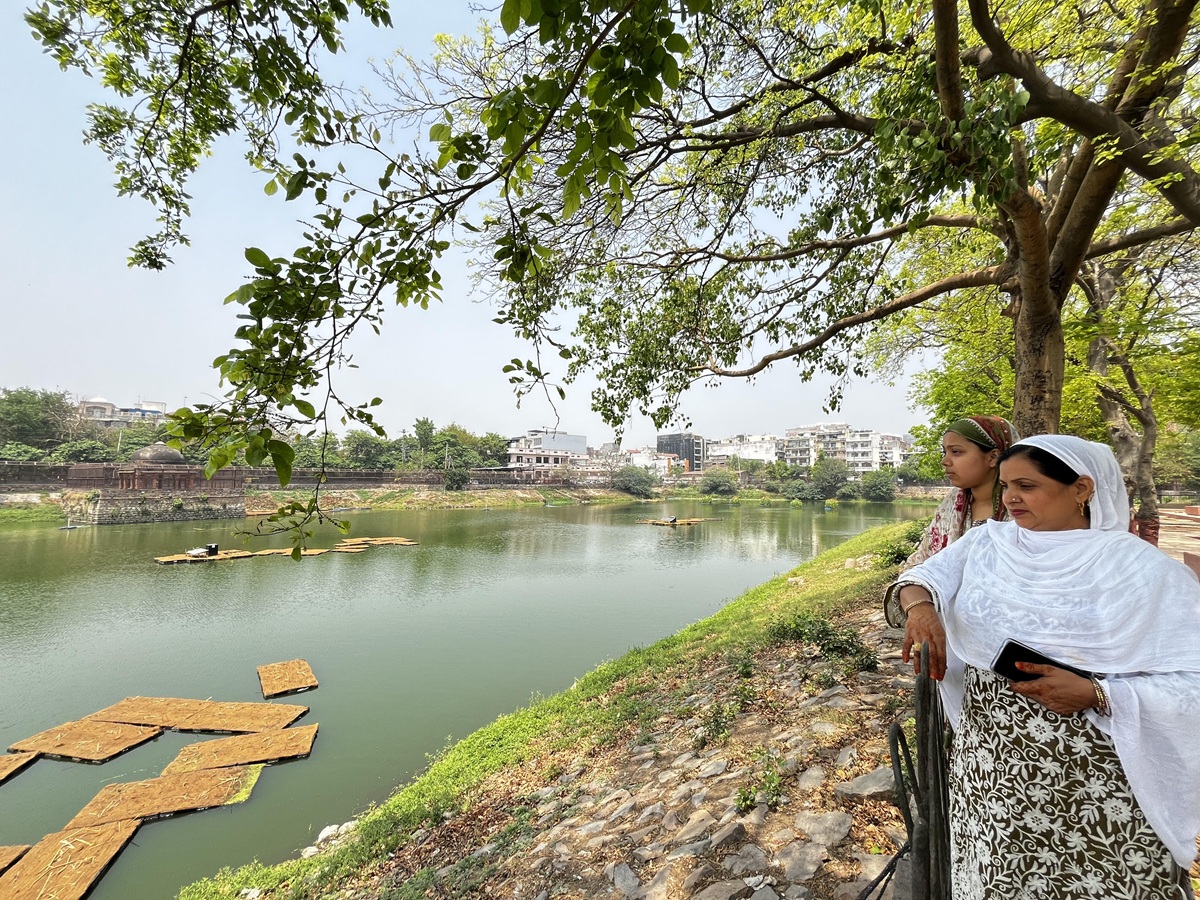 Zaida Zehra with her daughter looking at Hauz-i-Shamsi, their urban common.
