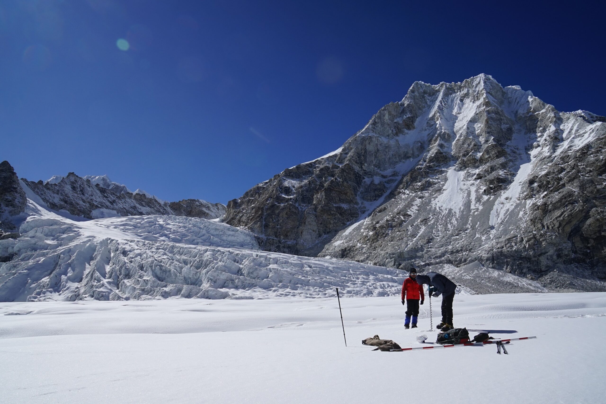 Researchers conduct fieldwork on the Trambau Glacier in Rolwaling region, Nepal in 2019. Image by Koji Fujita (Nagoya University).