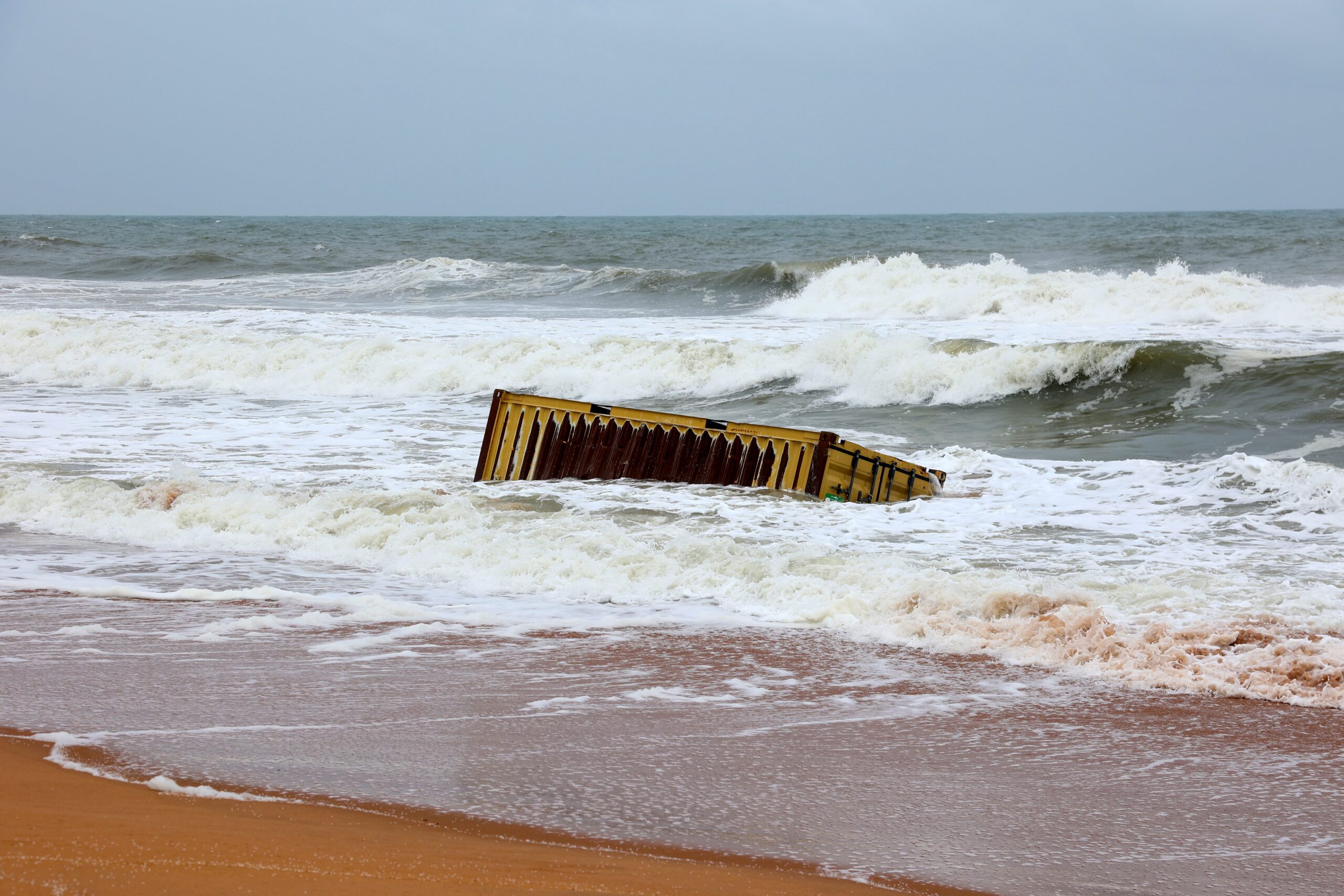 A container washed ashore in Thiruvananthapuram, Kerala from the ELSA-3 shipwreck. Some containers that washed to the coast were even seen catching fire in Kollam district. Image by John Bennet.