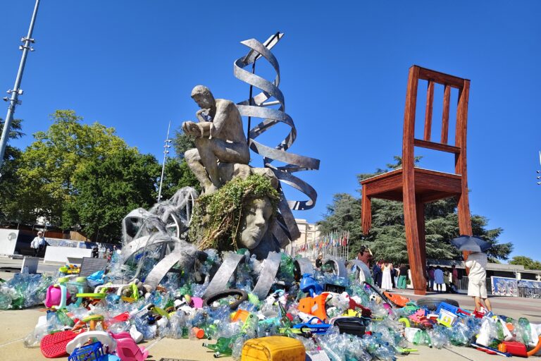 A man with a baby in his arms sat on the sculpture of Mother Earth, surrounded by broken plastic toys, bottles, and chairs scattered around. Every day, some more trash was added. Even as the man is seen thinking, Mother Earth, his own body, and the DNA helix above him, were all covered in plastic. Even as plastic has penetrated the foetus-symbolised by the DNA helix, the sea and the mountains, world leaders procrastinate to agree on a solution.