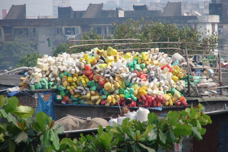 Plastic waste collected behind an industrial area near Mumbai. Plastic production contributes about 3.7% of global greenhouse gas emissions. Image by Ravleen Kaur.