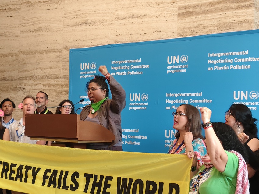 Yvette Arellano, who had nosebleeds during the 10-day Global Plastic Treaty negotiations in Geneva in August, protests with others. Image by Ravleen Kaur.