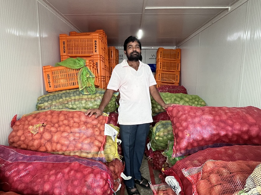 Bichitra Pradhan, director of Panchdhara FPO, at the solar-powered cold storage that helps farmers preserve their produce. Image by Nidhi Jamwal.