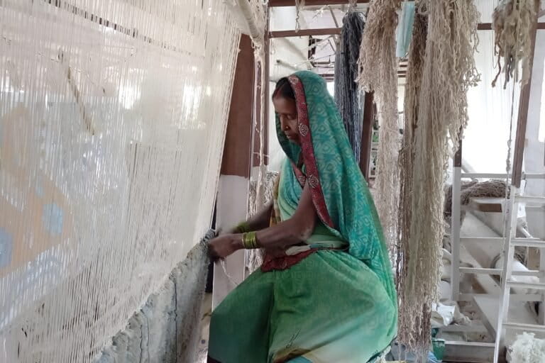 An artisan weaves a hand-tufted carpet in Bhadohi, a popular hand-tufted carpet industry hub in Uttar Pradesh. Image by Aslam Mahboob.