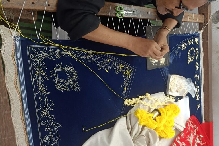 A Zardozi artisan at work. Zardozi is an artisanal hand embroidery technique that involves using metallic threads, stones and pearls to create opulent designs. Image by Zafar.