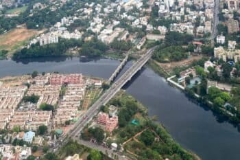 An aerial view of the Adyar river in Chennai, parts of which are blocked by sewage and garbage. However, on the Chennai beach where the Adyar and other rivers meet the Indian ocean, newborn olive Ridley turtles are seen making their way to the water. Image by Timothy A. Gonsalves via Wikmedia Commons (CC BY-SA 4.0).