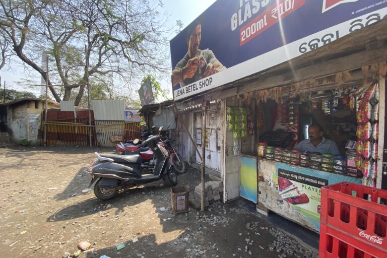 A betel shop continues to operate, while the shop next door has shut, due to dwindling business following the shutting down of a thermal power plant in Talcher, Odisha. Image by Roli Srivastava.
