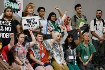 Youth at COP30 protest against fossil fuels, for a global just transition to clean energy and climate action. Image © UN Climate Change - Zô Guimarães.