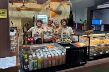 The team at Delícias Quilombolas, a family-run food stall that drew some of the longest queues in the COP30 Blue Zone in Belém. Image by Manish Chandra Mishra.