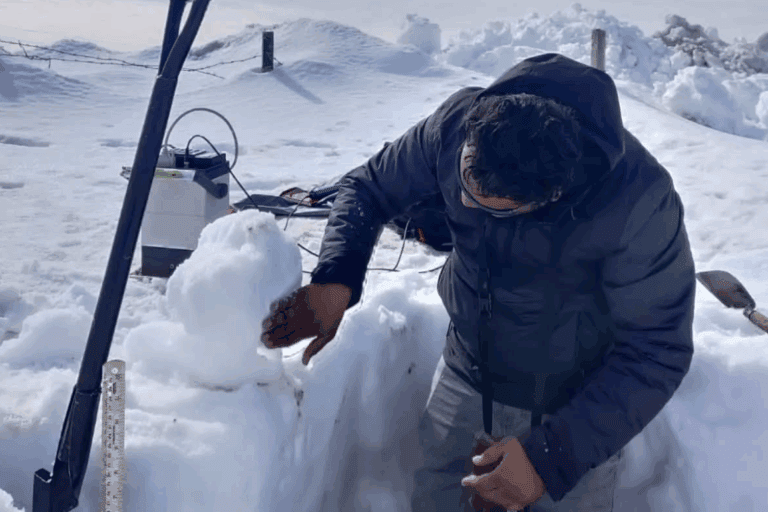 The lead author of a recent study measures snow depth at Nathatop near Patnitop in Jammu and Kashmir. The study finds snow droughts are on the rise in the Hindu Kush Himalayas. Image courtesy of Hemant Singh.