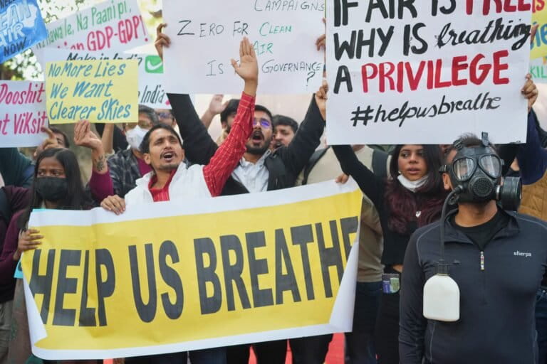 People are leaving cities to escape toxic air 2 Protests display slogans against the government's lack of action to combat air pollution in New Delhi on November 18, 2025. (AP Photo/Manish Swarup)