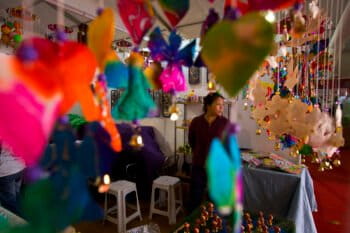 A stall owner waits for business visitors at the India International Trade Fair in New Delhi in 2014. (AP Photo/Saurabh Das)