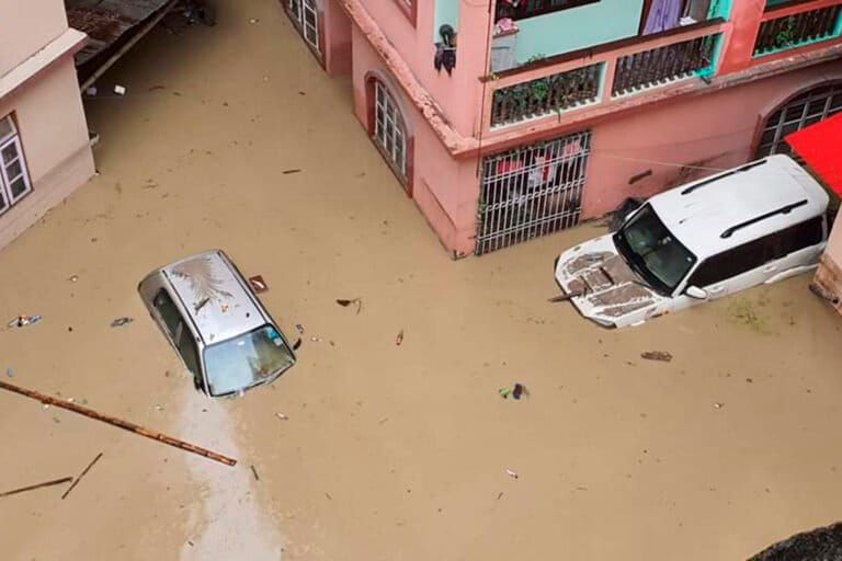 Cars lie submerged in Rangpo, Sikkim, following flash floods along the Teesta River triggered by heavy rainfall in 2023. (AP Photo/Prakash Adhikari) 