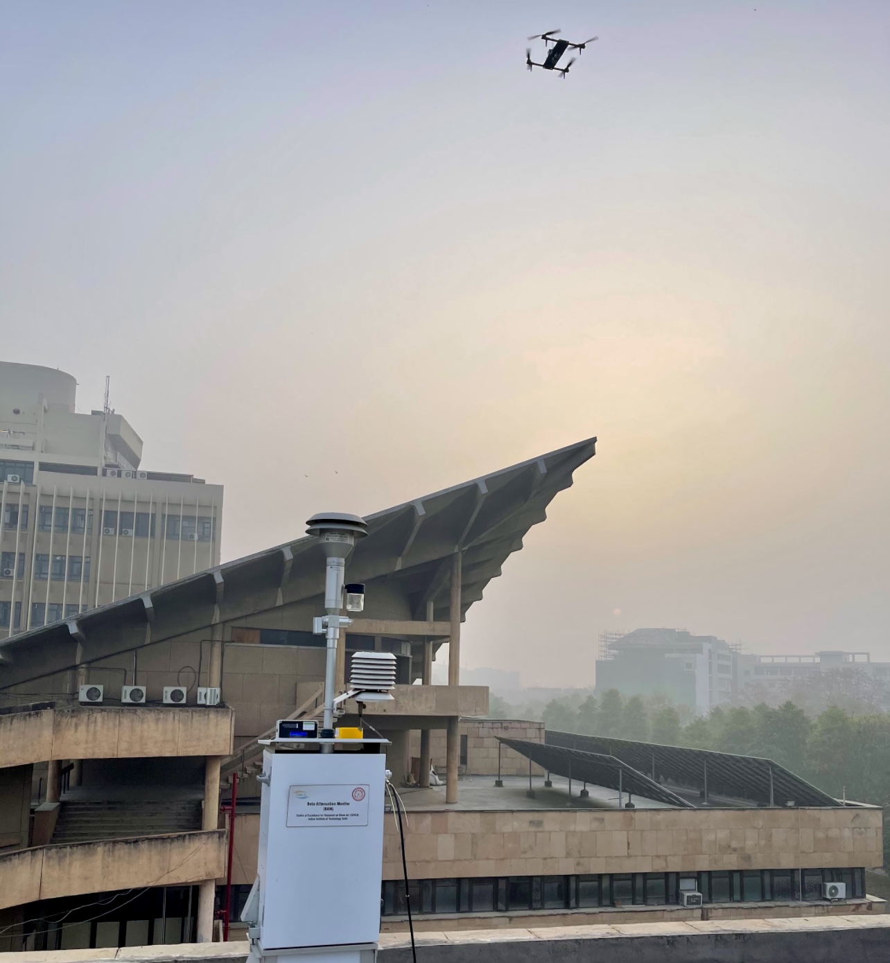 A drone carrying a modified low-cost PM sensor is compared with an E-BAM monitor while hovering during measurements.